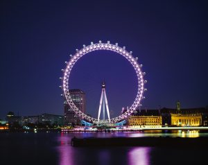 View from Victoria embankment at dusk. The London Eye by Marks Barfield Architects