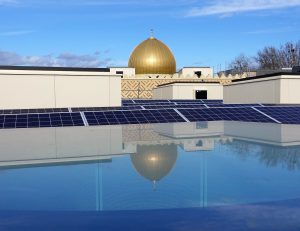 Dome reflected in PVs. The Cambridge Mosque by Marks Barfield Architects